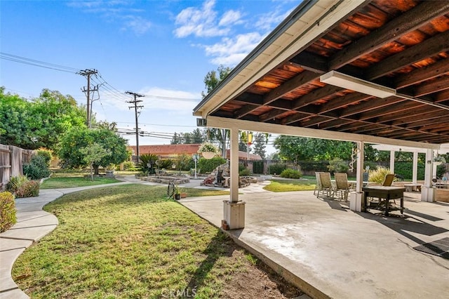 view of home's community featuring a lawn and a patio area