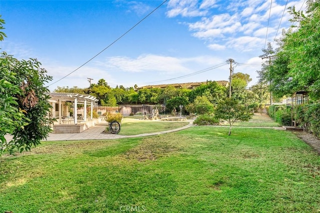 view of yard with a pergola and a patio