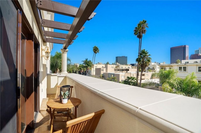 balcony featuring a pergola