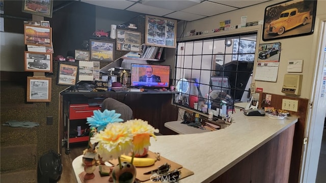 office featuring a paneled ceiling