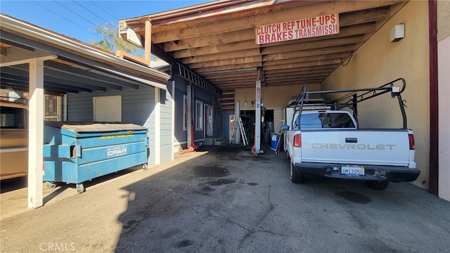 view of vehicle parking featuring a carport