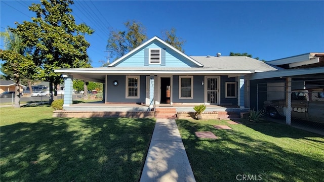 farmhouse inspired home with covered porch and a front lawn