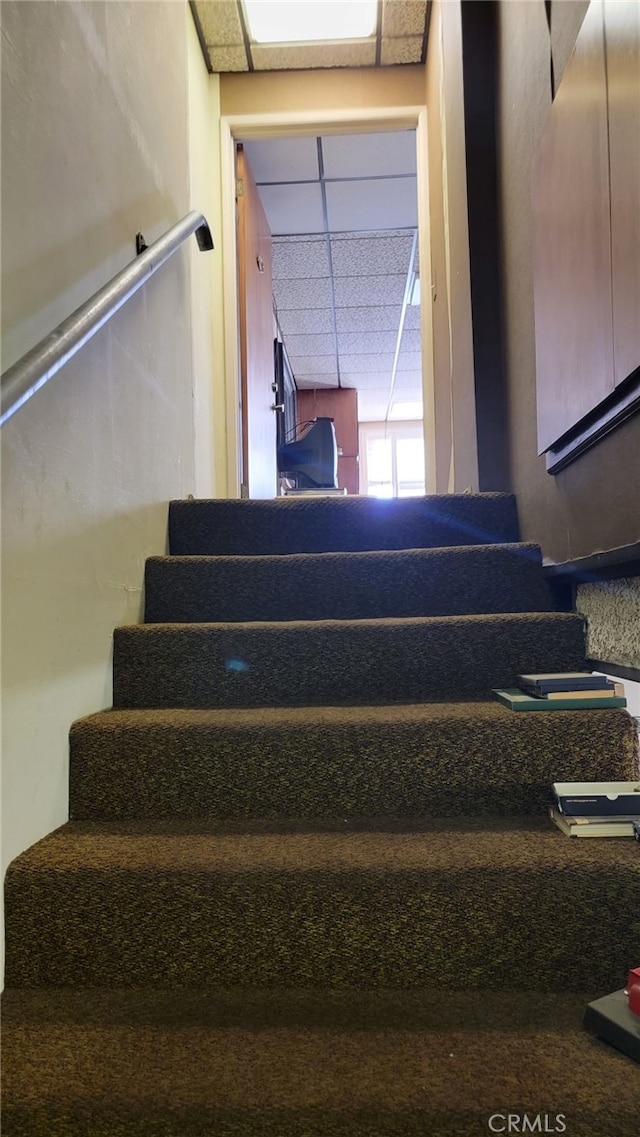 stairway with a drop ceiling