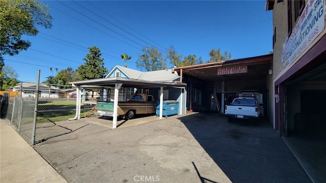 view of side of property featuring a carport