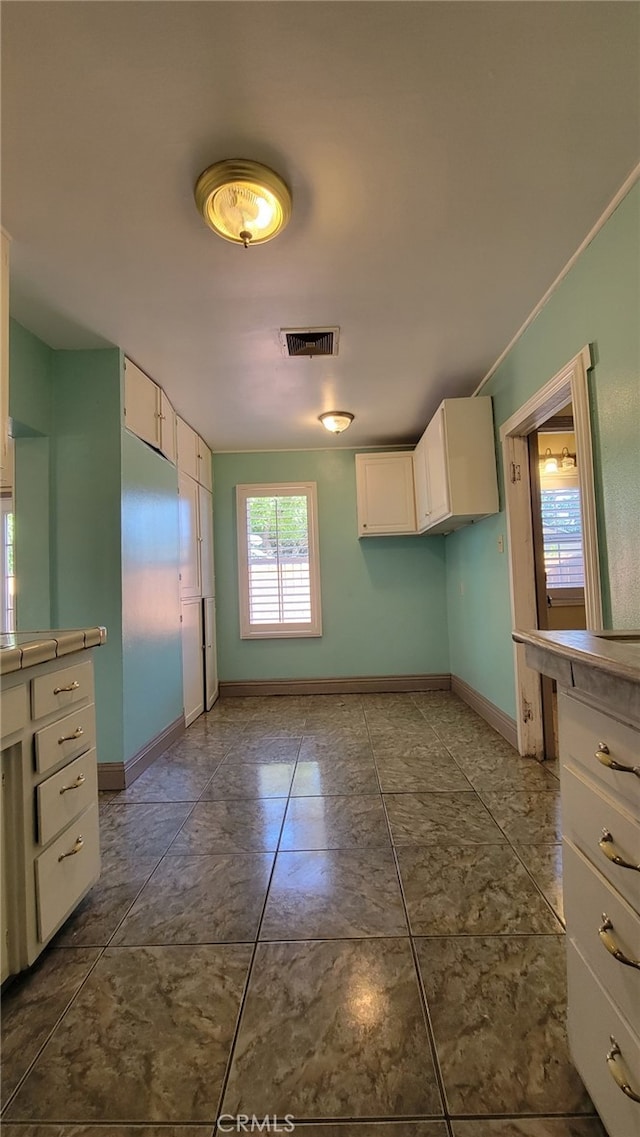 kitchen featuring white cabinetry