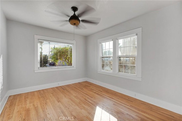 spare room featuring ceiling fan and light hardwood / wood-style floors