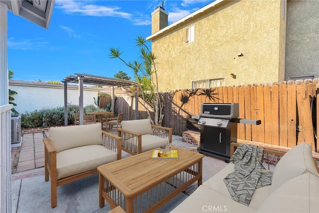 view of patio featuring an outdoor living space, area for grilling, and a pergola