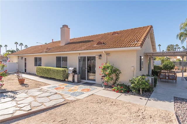 back of property with a patio area