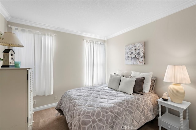 bedroom featuring carpet floors, a textured ceiling, baseboards, and crown molding