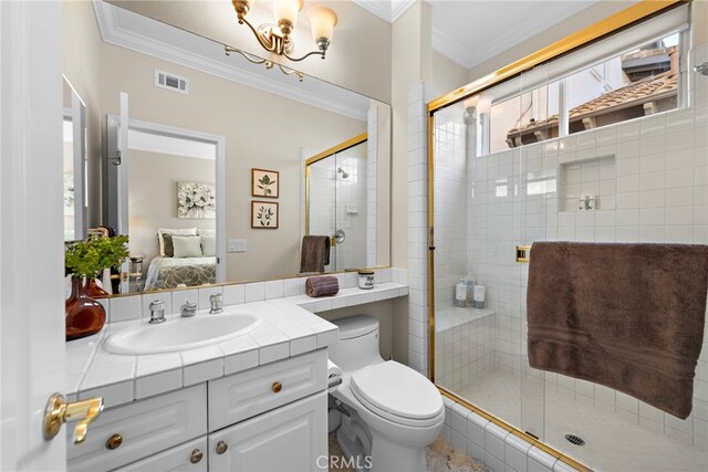 bathroom featuring crown molding, a shower with door, and a healthy amount of sunlight