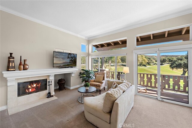 living room featuring light carpet, ornamental molding, and a premium fireplace