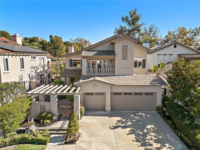 view of front of property with a balcony and a garage