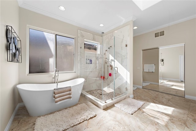 full bathroom with a freestanding tub, visible vents, baseboards, a marble finish shower, and crown molding