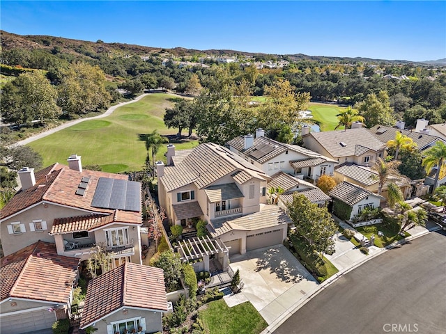 drone / aerial view featuring a residential view and golf course view