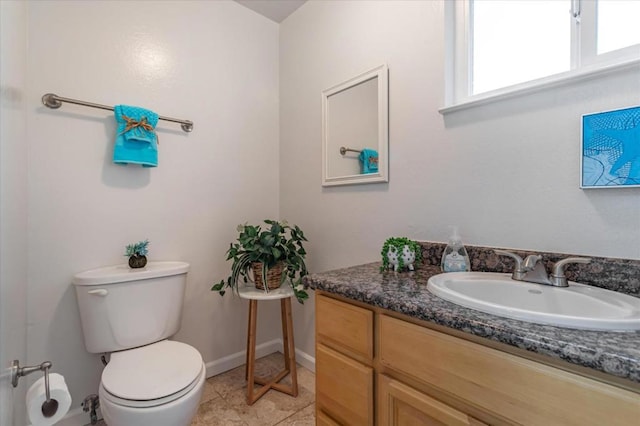 bathroom with tile patterned floors, vanity, and toilet