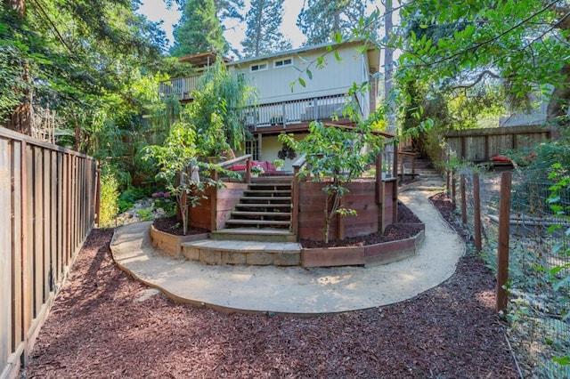 rear view of property with a wooden deck