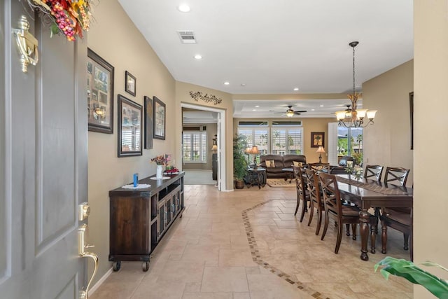 dining space featuring a chandelier and light tile patterned flooring