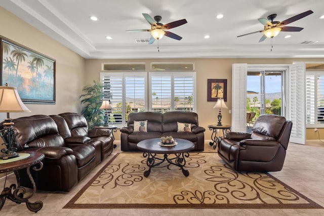 tiled living room featuring ceiling fan