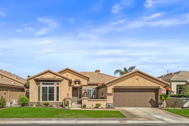 view of front facade featuring a garage and a front yard