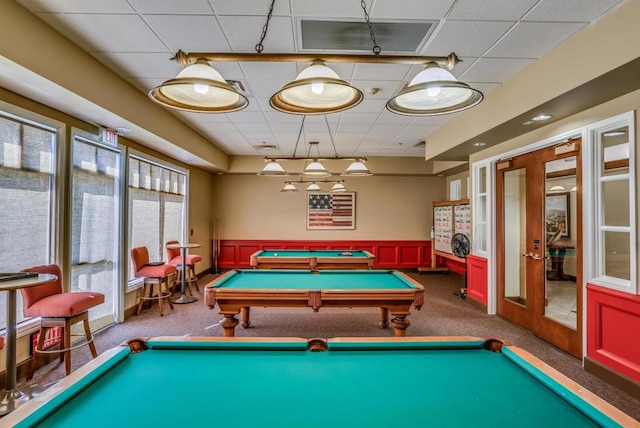 rec room with a paneled ceiling, billiards, french doors, and carpet