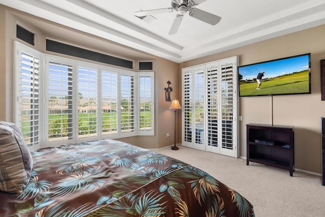 bedroom with ceiling fan, carpet flooring, multiple windows, and access to outside