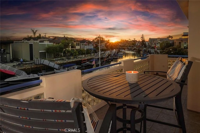 view of balcony at dusk