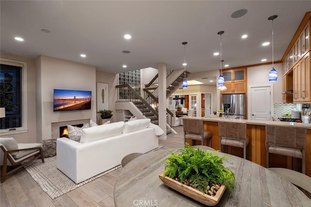 living room with light hardwood / wood-style flooring