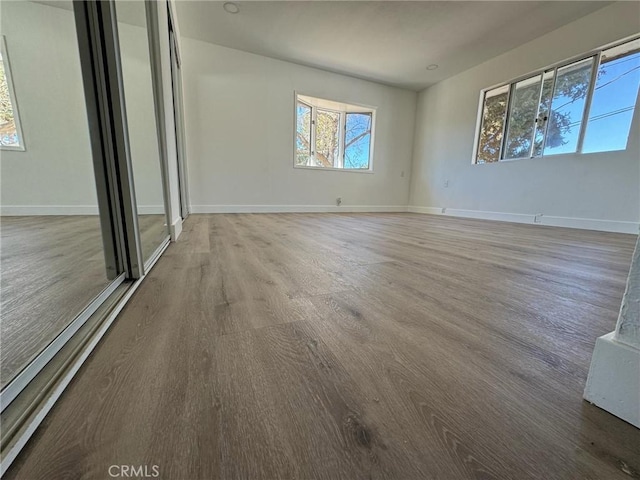 empty room featuring hardwood / wood-style flooring