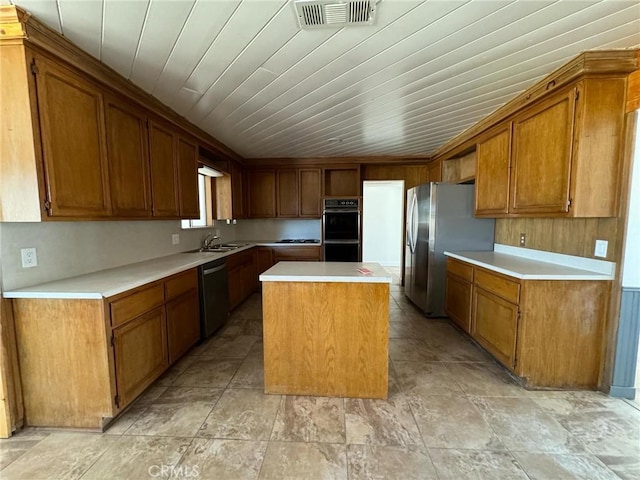 kitchen featuring stainless steel appliances, a kitchen island, wooden ceiling, and sink