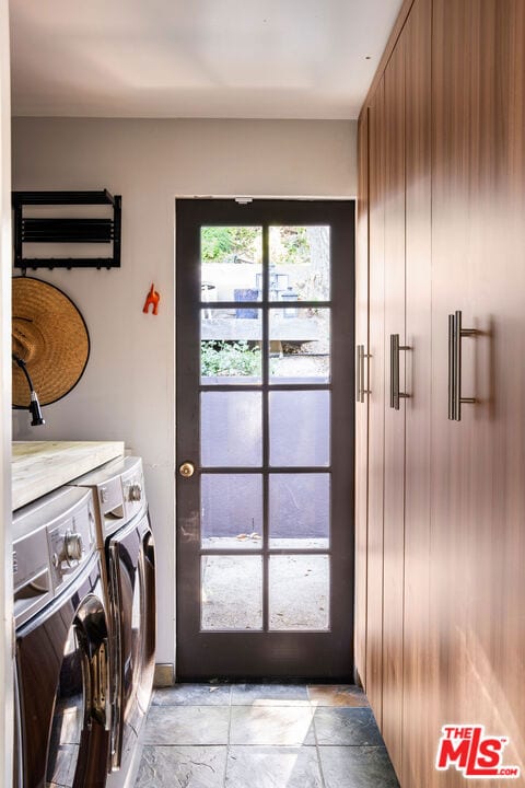 laundry area with independent washer and dryer