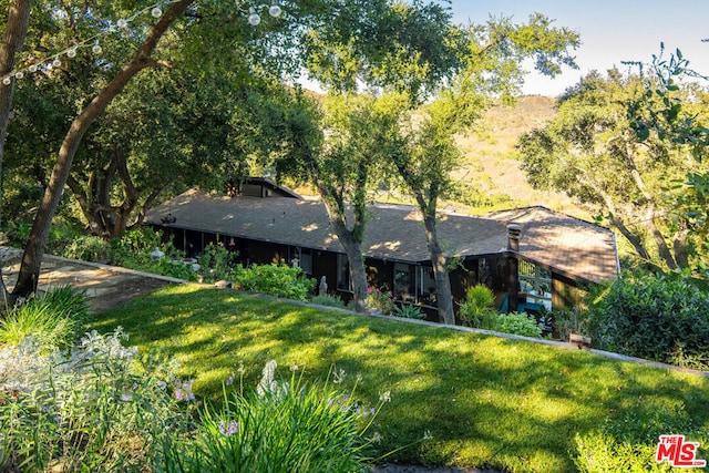 view of front of home with a front yard