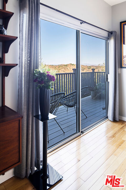 doorway to outside featuring hardwood / wood-style floors