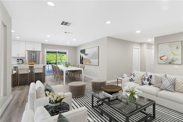 living room with light hardwood / wood-style floors