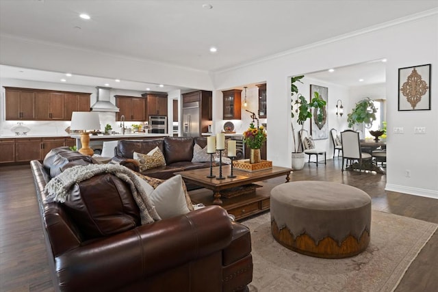 living room with dark hardwood / wood-style flooring and crown molding