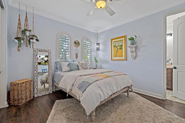 bedroom featuring dark wood-type flooring, ceiling fan, ornamental molding, and ensuite bathroom