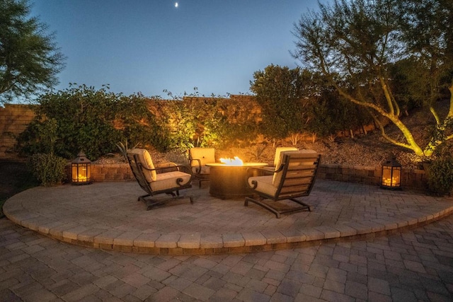 patio terrace at dusk with a fire pit