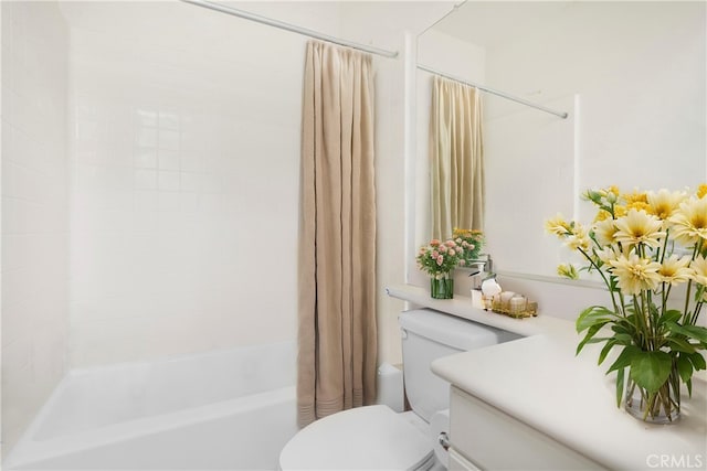 full bathroom featuring shower / bath combo, vanity, and toilet