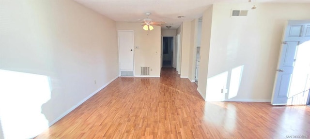 empty room featuring ceiling fan and light wood-type flooring