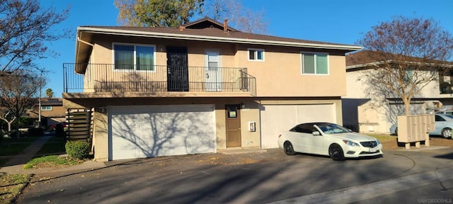 townhome / multi-family property featuring a garage