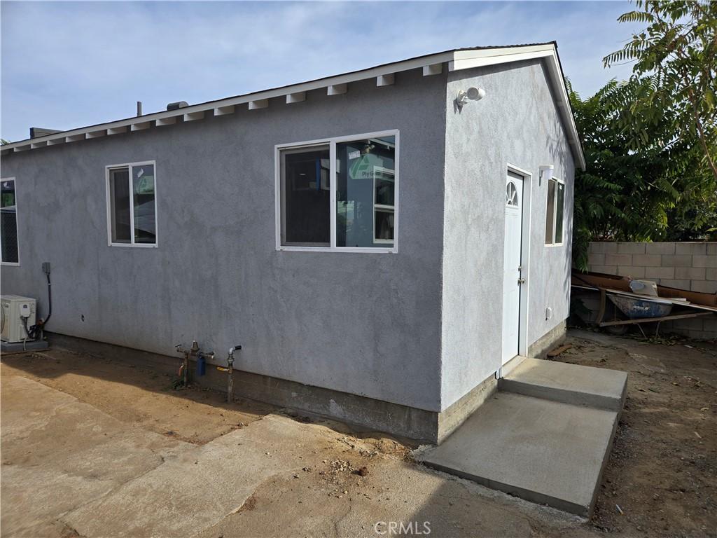 view of side of home featuring central air condition unit