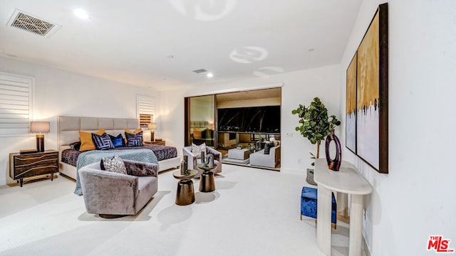 bedroom featuring light colored carpet