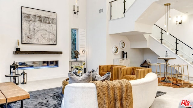 living room featuring a high ceiling