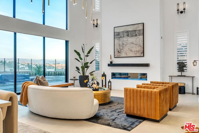 living room featuring a towering ceiling