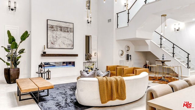 living room with a towering ceiling