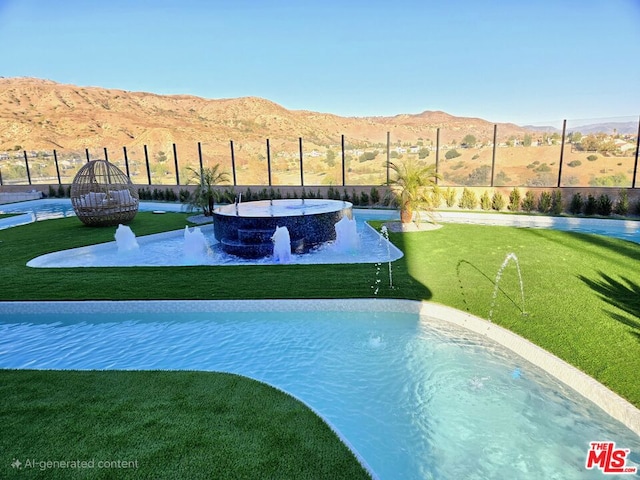 view of pool with a mountain view