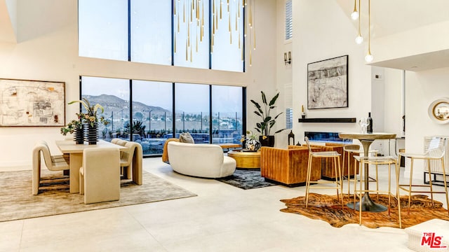 living room featuring a high ceiling and a mountain view