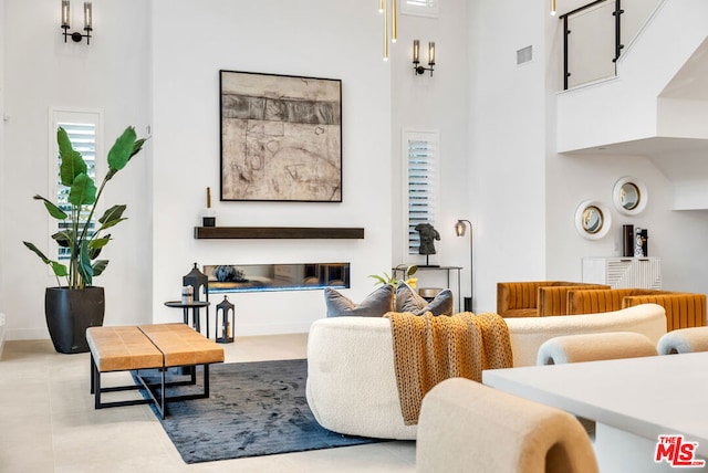 living room featuring a high ceiling