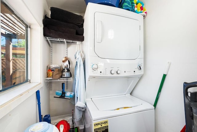 washroom with stacked washer and clothes dryer