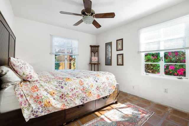 tiled bedroom with ceiling fan