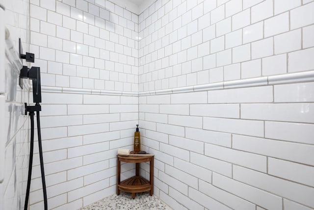 bathroom with tiled shower